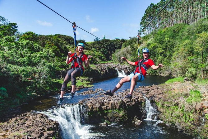 Big Island 9-Line Zipline Experience Plus Private Waterfall Swim - Umauma Falls ziplining feels more like a river park than a zip course