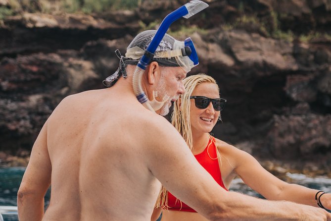 Deluxe Snorkel & Dolphin Watch Aboard a Luxury Catamaran from Kailua-Kona - Onboard fun between swims: slide, high jump, paddle toys, and lounge time